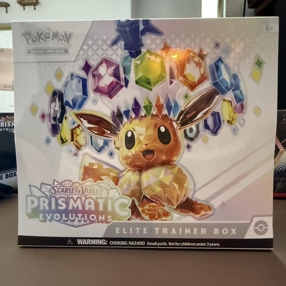 Meet the Posher Other - Pokemon Prismatic Evolutions Elite Trainer Box - Multi-Color Eevee Artwork